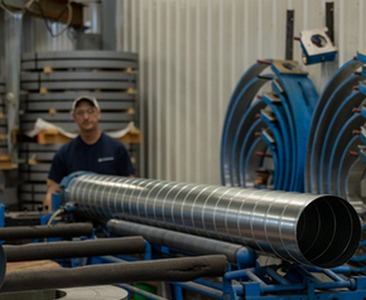 Worker rolling metal